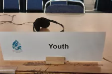 A sign on a desk that says Youth. Photo.
